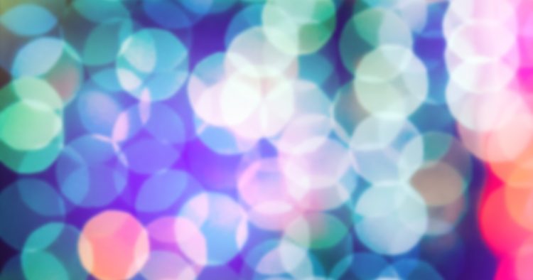 Abstract vibrant bokeh lights in soft focus, symbolizing a candidate's glowing qualities and standing out in the job market.