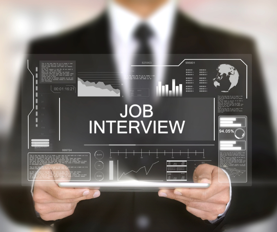 A man holding a tablet with a graphic that says job interview