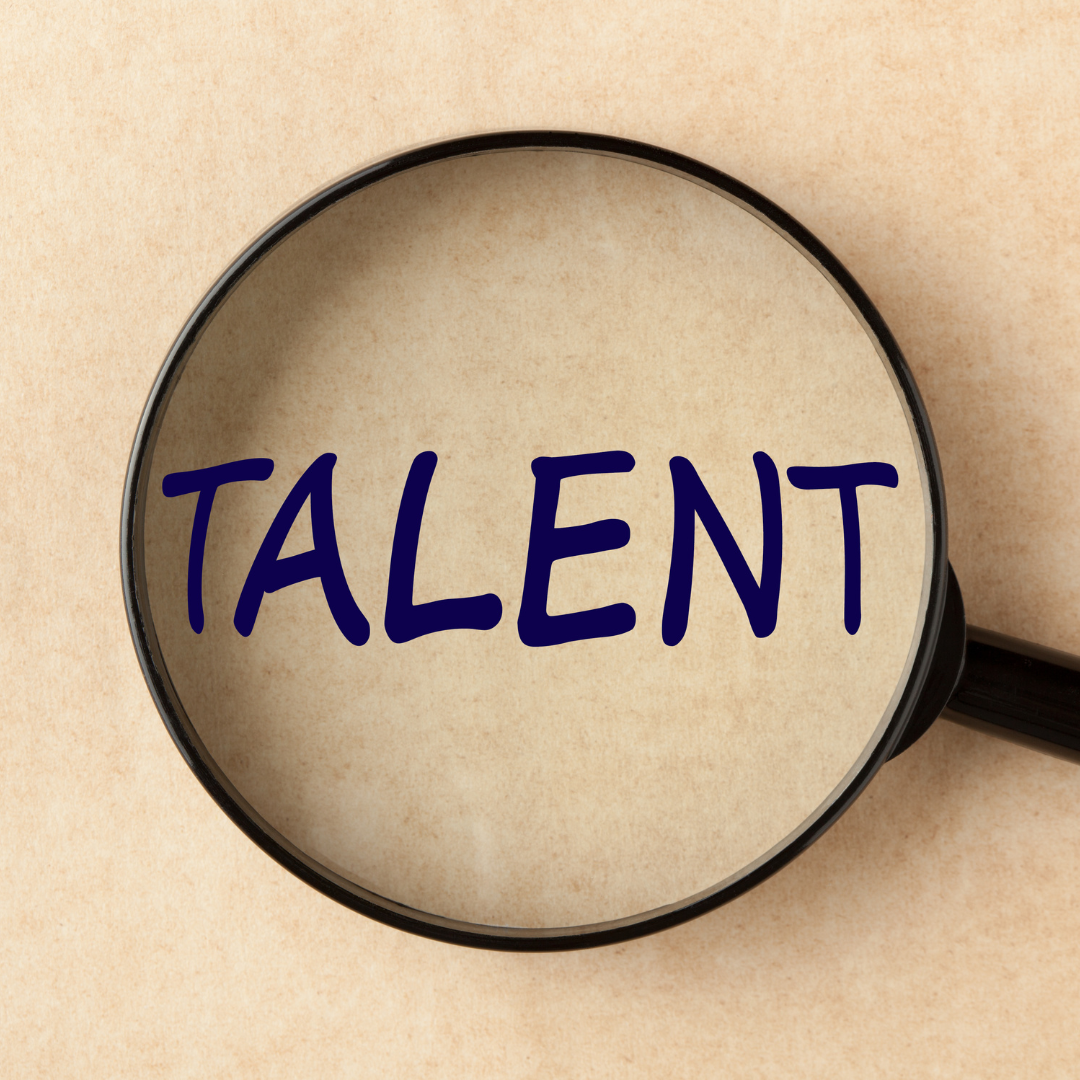 A magnified glass over the word talent