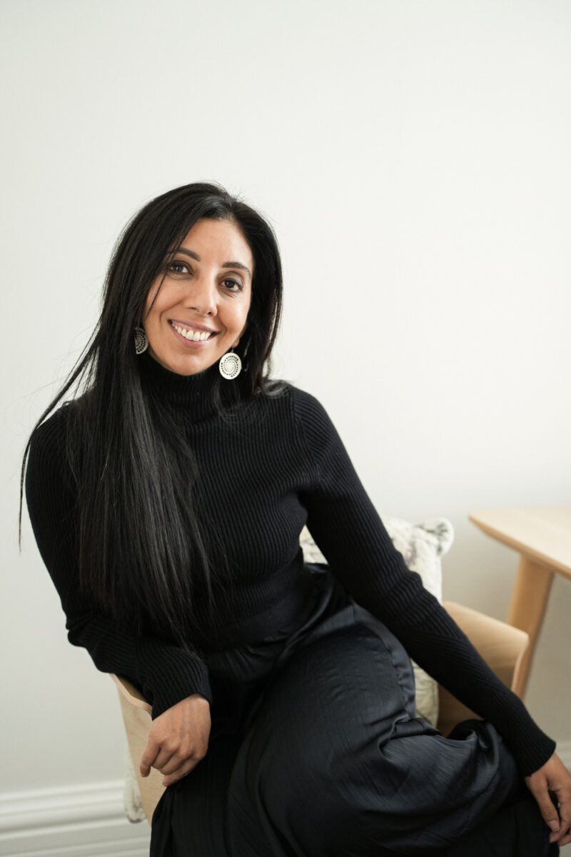 Leena Parmar, founder and CEO of Citrus Connect sitting down and smiling