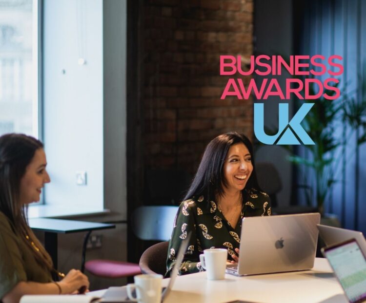 Citrus Connect Founder Leena Parmar and her recruitment team collaborating at a conference table, featuring the Business Awards UK logo.