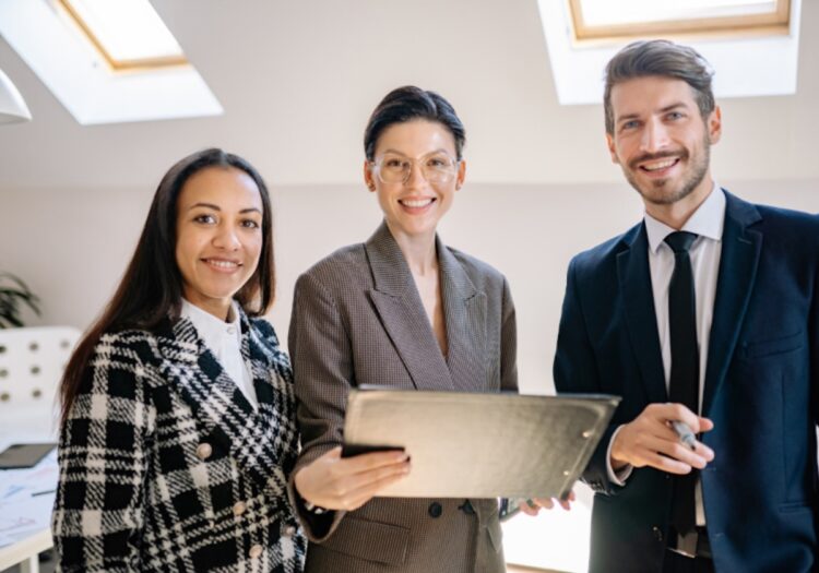 A professional team reviewing ethical sales recruitment strategies on a tablet.