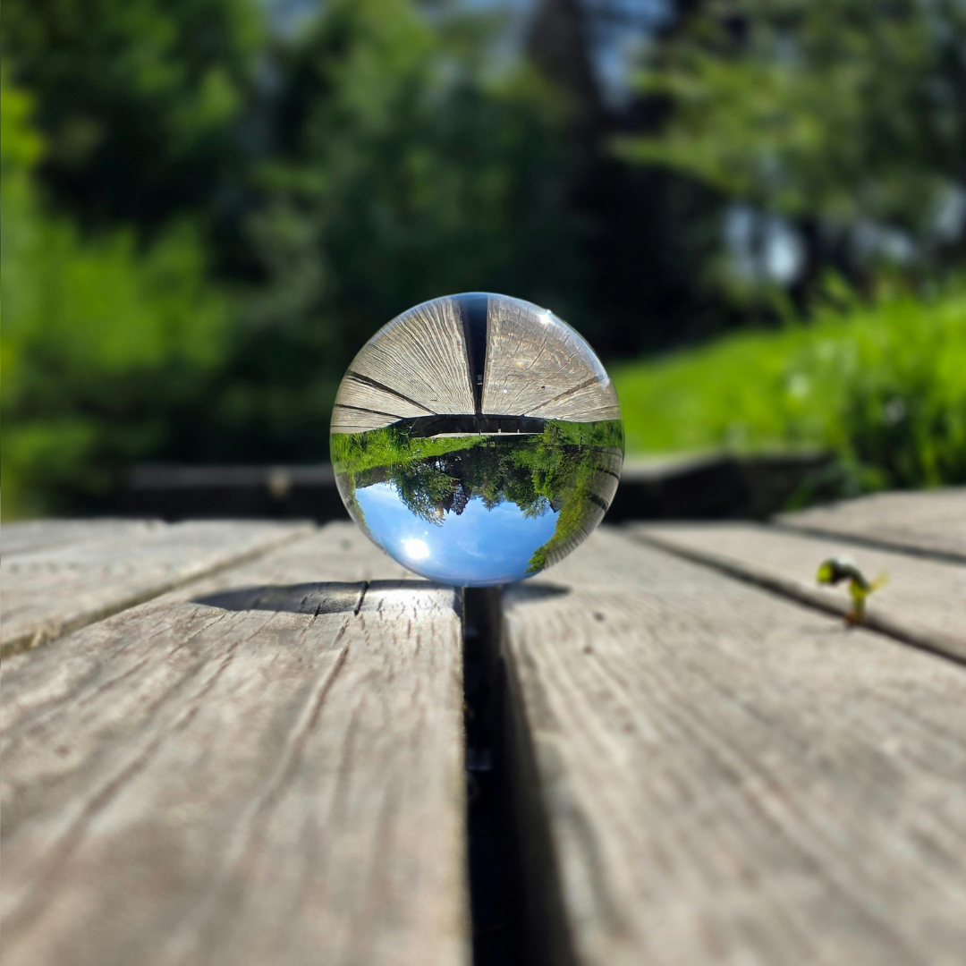 Glass sphere reflecting the surrounding landscape