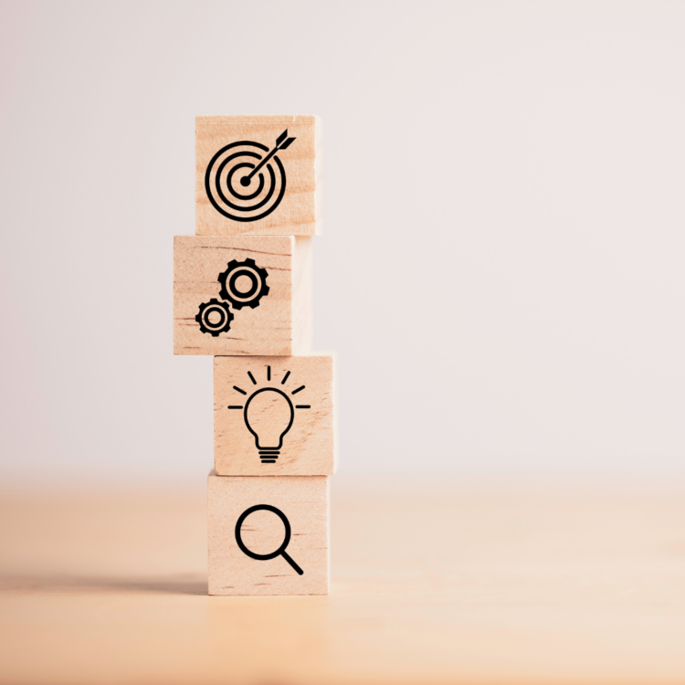 A vertical stack of wooden blocks with business strategy icons illustrating steps to optimize sales recruitment pipeline velocity.