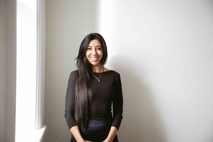 Leena Parmar, Founder of Citrus Connect Recruitment, standing in a natural sunlit portrait.