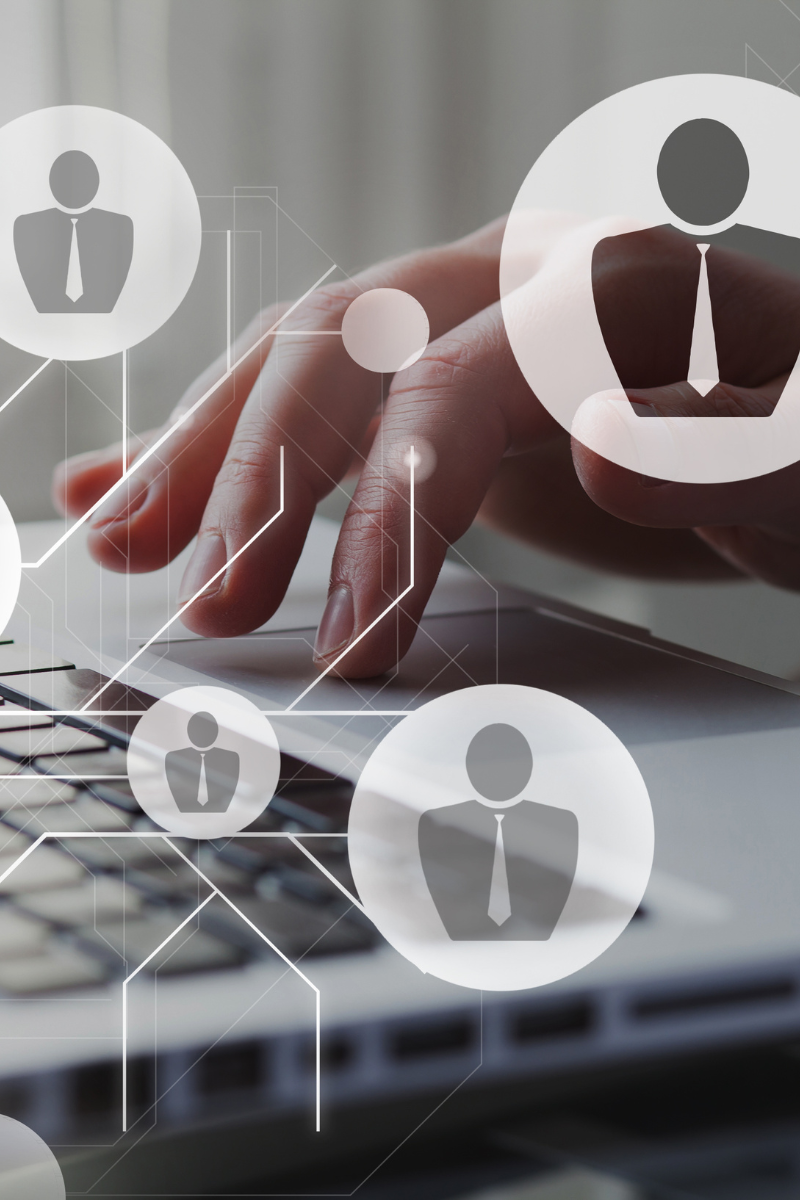Close-up of a person using a laptop with digital candidate profile icons representing an expanding UK sales talent pool.